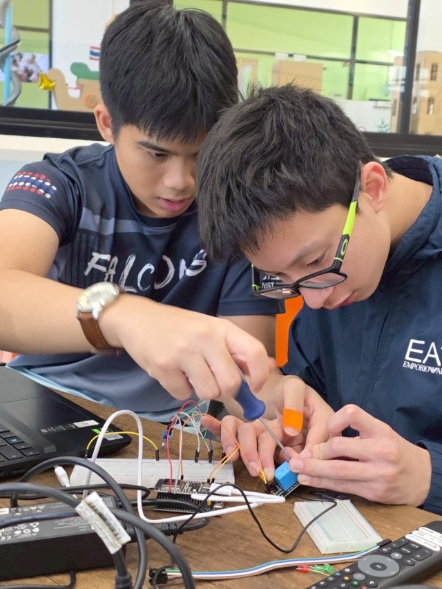 Tul and Ming assembling the prototype electronics